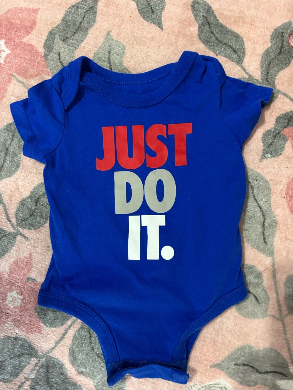 Nike “Just Do It." Kids One-Piece Bodysuit